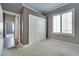 Bedroom with closet and window with shutters and an open doorway at 10513 Longwood Dr, Las Vegas, NV 89134