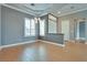 Bright dining room features wood-look tile flooring, white trim and grey walls at 10513 Longwood Dr, Las Vegas, NV 89134