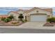 Charming one-story home with a two-car garage and desert landscaping at 10513 Longwood Dr, Las Vegas, NV 89134