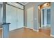 Welcoming foyer with wood-look tile flooring and access to other rooms at 10513 Longwood Dr, Las Vegas, NV 89134