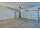 Clean and organized two-car garage with epoxy floors and built-in storage cabinets at 10513 Longwood Dr, Las Vegas, NV 89134