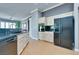 Kitchen features wood cabinets, black countertops, and stainless steel appliances at 10513 Longwood Dr, Las Vegas, NV 89134