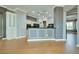 The gourmet kitchen has custom cabinets, black countertops and black appliances at 10513 Longwood Dr, Las Vegas, NV 89134