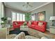 Comfortable living room with neutral tones, wood-style floors and big windows with white shutters at 10513 Longwood Dr, Las Vegas, NV 89134