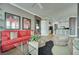 Open floor plan displays the flow from kitchen to living room in neutral colors and wood-style floors at 10513 Longwood Dr, Las Vegas, NV 89134