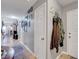 Hallway featuring neutral paint, tile floors, and access to other rooms in the home at 1060 Neil Armstrong Cir, Las Vegas, NV 89145