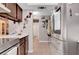 This kitchen features stainless steel refrigerator, tile flooring, and ample countertop space at 1060 Neil Armstrong Cir, Las Vegas, NV 89145