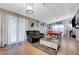Living room with tile floors, a pool table, sofa, and ample natural light at 1060 Neil Armstrong Cir, Las Vegas, NV 89145
