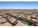A panoramic aerial view of a residential neighborhood on a sunny day at 10750 Red Badge Ave, Las Vegas, NV 89166