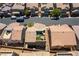 An aerial view of a modern home with a rooftop patio in a residential neighborhood at 10750 Red Badge Ave, Las Vegas, NV 89166