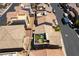 A high angle view of multiple two-story homes with tile roofs and some with rooftop patios in a planned community at 10750 Red Badge Ave, Las Vegas, NV 89166