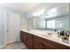 Spacious bathroom with dual sinks, a large mirror, and ample counter space at 10750 Red Badge Ave, Las Vegas, NV 89166