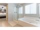 Bathroom featuring a shower, large soaking tub and natural light from the window at 10750 Red Badge Ave, Las Vegas, NV 89166
