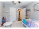 Bright bedroom with whimsical decor, a twin bed, and ample natural light at 10750 Red Badge Ave, Las Vegas, NV 89166