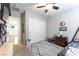 Bedroom with large closet, a rustic-style bed, and a ceiling fan at 10750 Red Badge Ave, Las Vegas, NV 89166