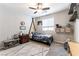 Stylish bedroom featuring a unique bed, mounted shelves and a ceiling fan at 10750 Red Badge Ave, Las Vegas, NV 89166