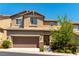 Charming two-story home with a two-car garage and desert landscaping at 10750 Red Badge Ave, Las Vegas, NV 89166