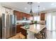 Modern kitchen with granite countertops, stainless steel appliances, and a center island at 10750 Red Badge Ave, Las Vegas, NV 89166