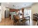 Eat-in kitchen featuring stainless steel appliances, wooden cabinetry, and a central island at 10750 Red Badge Ave, Las Vegas, NV 89166