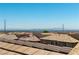 A rooftop view of a Las Vegas suburb on a clear day showcasing the distant mountains at 10750 Red Badge Ave, Las Vegas, NV 89166