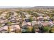 Overhead shot of a residential community with a glimpse of sparkling swimming pools and lush greenery at 11112 Pine Greens Ct, Las Vegas, NV 89144