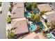 Aerial view shows home with a refreshing pool and the well-maintained landscaping in a desirable neighborhood at 11112 Pine Greens Ct, Las Vegas, NV 89144
