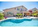 Beautiful backyard with a private pool, lounging area, and mature trees at 11112 Pine Greens Ct, Las Vegas, NV 89144