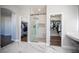 Bathroom featuring dual walk-in closets and a glass shower at 11112 Pine Greens Ct, Las Vegas, NV 89144