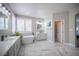 Bathroom featuring dual vanities, a freestanding tub, and an ensuite bedroom at 11112 Pine Greens Ct, Las Vegas, NV 89144