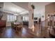 Spacious dining and living area with wood floors and open access to staircase at 11112 Pine Greens Ct, Las Vegas, NV 89144