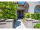 Inviting entryway featuring a double front door and manicured landscaping at 11112 Pine Greens Ct, Las Vegas, NV 89144