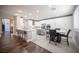 Spacious kitchen with white cabinetry, a marble countertop island, and stainless steel appliances at 11112 Pine Greens Ct, Las Vegas, NV 89144