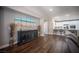 Open-concept living room with wood floors and access to the kitchen and dining area at 11112 Pine Greens Ct, Las Vegas, NV 89144