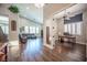 Inviting living room with dark floors, high ceilings, and a comfortable leather sectional at 11112 Pine Greens Ct, Las Vegas, NV 89144
