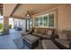 Inviting covered patio with comfortable seating, perfect for outdoor relaxation at 11112 Pine Greens Ct, Las Vegas, NV 89144