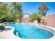 Backyard pool with desert landscaping, a rock waterfall feature and space for outdoor seating at 11112 Pine Greens Ct, Las Vegas, NV 89144