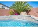 Close up of the backyard pool with a rock waterfall feature at 11112 Pine Greens Ct, Las Vegas, NV 89144