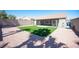 A spacious backyard featuring gravel and artificial turf, perfect for outdoor activities and enjoyment at 11119 River Hills Ln, Las Vegas, NV 89135