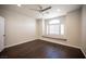 Bedroom with hardwood floors, a ceiling fan and a window seat that can be used for storage at 11119 River Hills Ln, Las Vegas, NV 89135