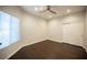 Bright bedroom with hardwood floors, a ceiling fan, and a closet for storage at 11119 River Hills Ln, Las Vegas, NV 89135