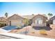 Charming single-story home featuring a two-car garage and low maintenance desert landscaping at 11119 River Hills Ln, Las Vegas, NV 89135