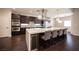 Gourmet kitchen featuring an island with seating, stainless steel appliances, and ample cabinet space at 11119 River Hills Ln, Las Vegas, NV 89135