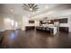 Bright open floor plan boasting dark wood floors and a modern kitchen with an eat-in center island at 11119 River Hills Ln, Las Vegas, NV 89135