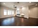 Large living room boasts dark hardwood floors, a modern fireplace, and recessed lighting at 11119 River Hills Ln, Las Vegas, NV 89135