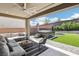 Inviting backyard features a hot tub, manicured lawn, and stylish seating, creating a perfect outdoor retreat at 12155 Sage Thunder Ave, Las Vegas, NV 89138