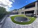 Backyard with artificial grass, basketball court, in-ground trampoline, and jacuzzi at 12155 Sage Thunder Ave, Las Vegas, NV 89138