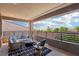 Outdoor balcony is furnished with a comfortable seating area offering an inviting space for relaxation and enjoying views at 12155 Sage Thunder Ave, Las Vegas, NV 89138