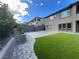 Backyard featuring a basketball court, artificial grass, and view of the home's exterior at 12155 Sage Thunder Ave, Las Vegas, NV 89138