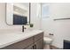 Bright bathroom with a single sink vanity with white countertop and a shower with a patterned curtain at 12155 Sage Thunder Ave, Las Vegas, NV 89138