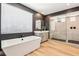 Spa-like bathroom featuring a modern tub, frameless glass shower, and sleek vanity at 12155 Sage Thunder Ave, Las Vegas, NV 89138
